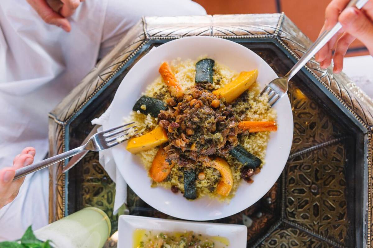 including watermelons, avocados, and green beans, in colorful bowls.